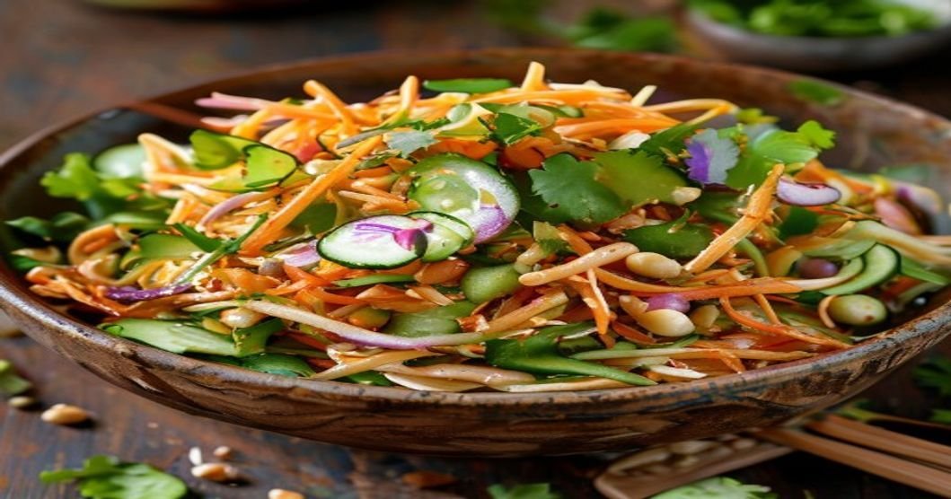 Here are concise, SEO-friendly alt text options under 120 characters: 1. **Cold peanut noodle salad with mixed veggies and protein** 2. **Peanut noodle salad with crunchy veggies and savory sauce** 3. **Asian-inspired cold noodle salad with peanut dressing** 4. **Hearty peanut noodle salad with everything but the kitchen sink** 5. **Fresh veggie-packed peanut noodle salad bowl**