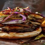 Here are some concise and SEO-friendly alt text options under 120 characters: 1. **Vegan mushroom pulled pork sandwich with BBQ sauce** 2. **Plant-based pulled pork made from mushrooms** 3. **Meaty vegan pulled pork with savory mushrooms** 4. **BBQ mushroom pulled pork – vegan & delicious** 5. **Hearty vegan pulled pork substitute with mushrooms** 6. **Savory mushroom pulled pork – 100% plant-based** 7. **Vegan BBQ pulled pork made from mushrooms** 8. **Juicy mushroom pulled pork – great meat alternative**