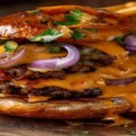 Spicy vegan sloppy joes with lentils and savory sauce on a toasted bun