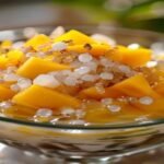 Vegan mango coconut sago dessert with creamy texture and tropical flavors (119 characters)