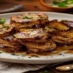 Roasted cabbage steaks with garlic butter on a plate